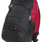 A black and red backpack with multiple compartments and zipper closures. The bag features a mesh side pocket, grommet details, and padded straps. It is standing upright against a plain background.