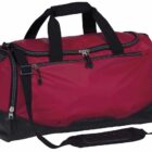 A red and black duffel bag with multiple compartments and a shoulder strap. The zippers are silver, and the handles are black. The base of the bag is reinforced for durability.