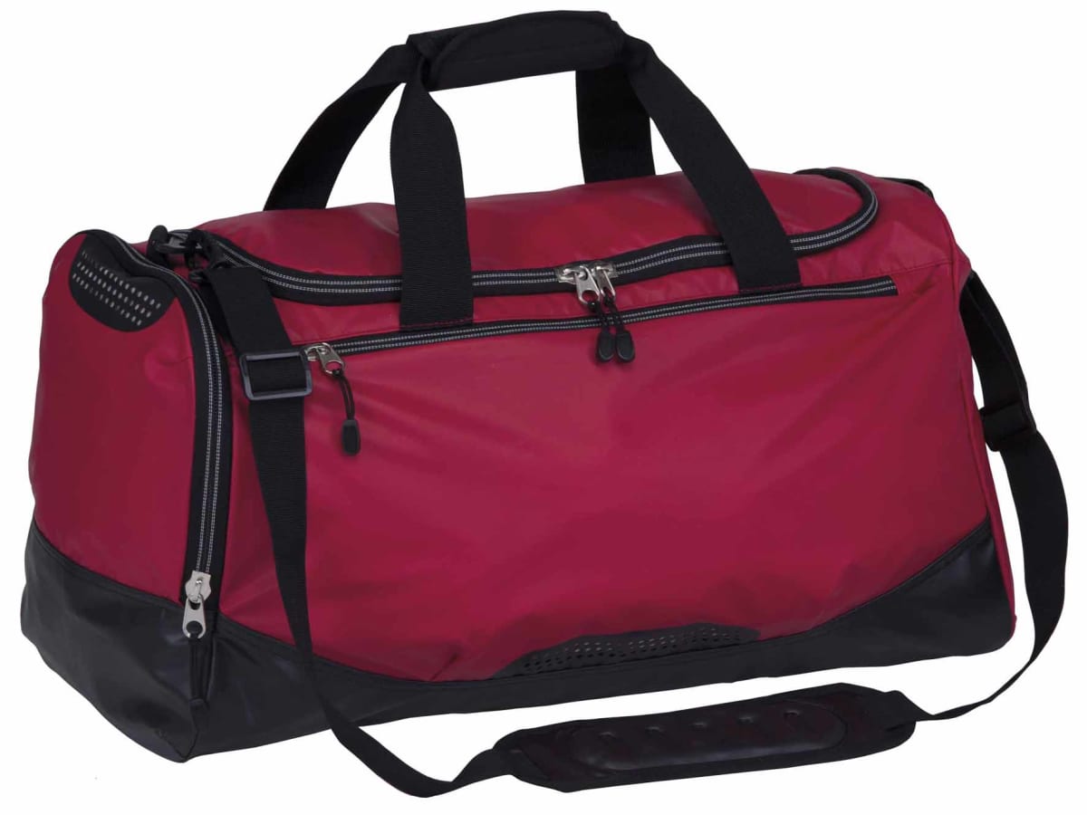 A red and black duffel bag with multiple compartments and a shoulder strap. The zippers are silver, and the handles are black. The base of the bag is reinforced for durability.