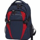A navy blue and red backpack with multiple zippered compartments, side mesh pockets, and adjustable straps. The design features sleek curves and sturdy construction, suitable for everyday use.