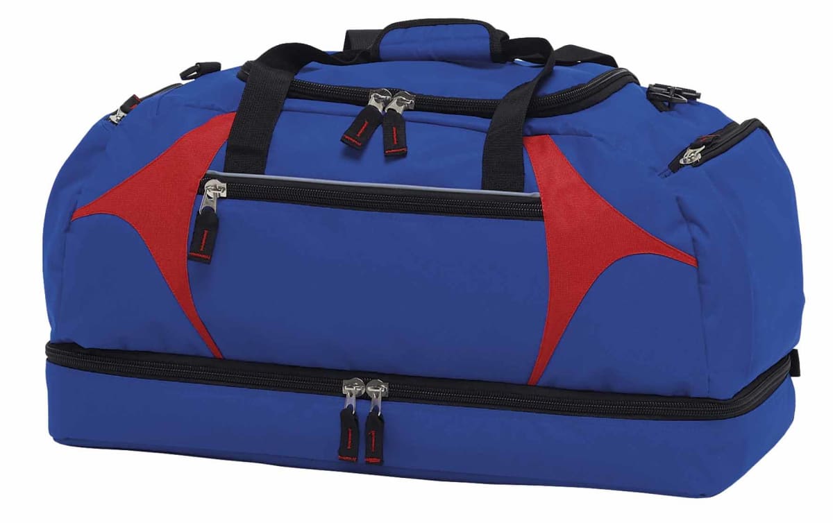 A blue and red duffel bag with multiple zippered compartments, black handles, and an adjustable shoulder strap, displayed against a white background.