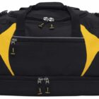 Black duffel bag with yellow accents, featuring dual zippers on the top and a separate zippered compartment on the bottom. It has a front zip pocket and two handles for carrying.