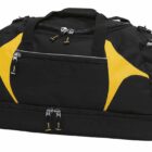 A black sports duffle bag with yellow accents. It features a zippered main compartment, additional side pockets, and a separate zippered bottom section. The bag has two handles and appears spacious and suitable for gym or travel use.