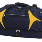 A navy blue and yellow gym bag with multiple zippers and compartments. It has black handles and a detachable shoulder strap. The bag features a spacious main section and a separate bottom compartment.