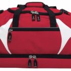 A red duffel bag with black straps and zippers, featuring white triangular designs on its sides. The bag has multiple compartments and is shown against a white background.