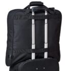 A black wheeled suitcase with a telescopic handle extended. The suitcase has a rectangular shape and a soft exterior, featuring a smaller zippered compartment attached to the back.