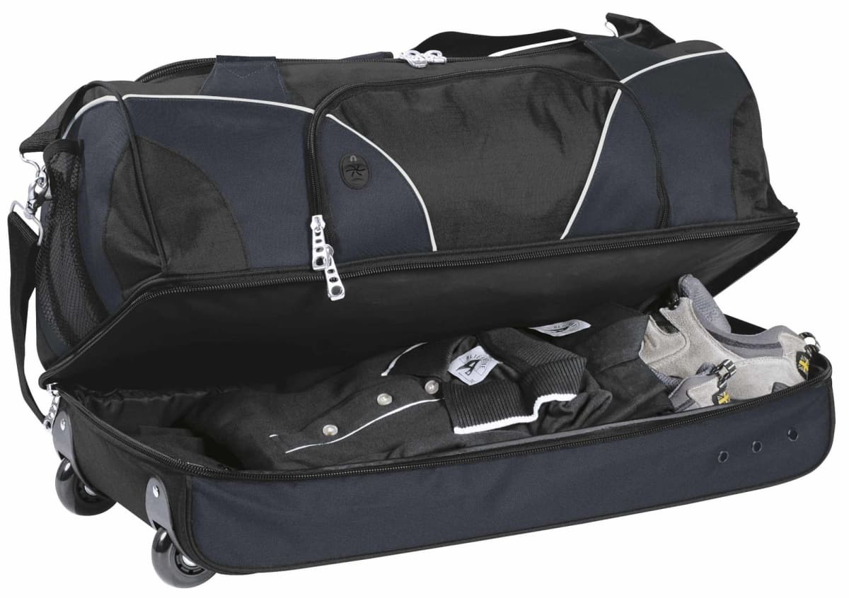 A large black wheeled duffel bag with a zippered top compartment, partially open to reveal neatly packed clothes and shoes inside. The bag has carrying handles and appears sturdy for travel.