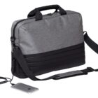 A gray and black laptop bag with a handle and adjustable shoulder strap. It features a built-in external USB port connected to a smartphone via a charging cable.