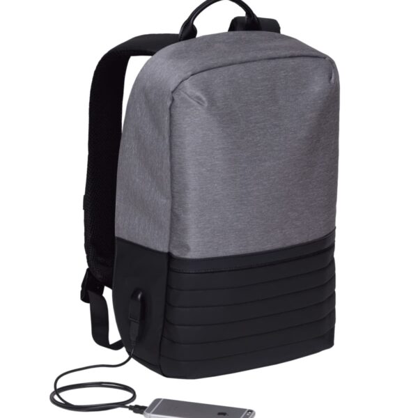A sleek, modern gray and black backpack with padded straps and a USB charging port. Its shown with a smartphone connected to the port, emphasizing the bags tech-friendly design.