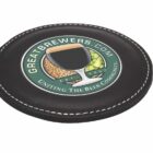A circular black coaster with a logo depicting a glass of beer partially filled with hops and grains. The text reads GreatBrewers.com - Uniting the Beer Community - Est. 2007.