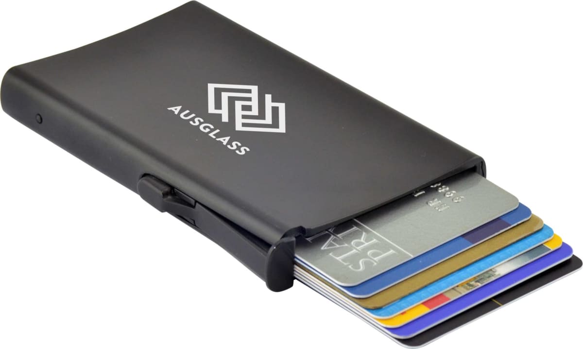 A black card holder with the AUSGLASS logo, displaying an organized array of colorful credit cards partially extended from its slot.