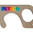 Cut-out tool with an irregular shape, featuring a label saying PROTECTO in rainbow-colored letters. It has a circular hole on one end and a smaller hole on the bottom right.