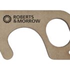 A beige touch tool with a circular hole and a hook shape, featuring the logo and text ROBERTS & MORROW on its surface.