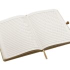 An open, blank notebook with lined pages and a beige ribbon bookmark is shown against a white background. The cover is slightly visible and light brown, giving the notebook a simple and classic appearance.