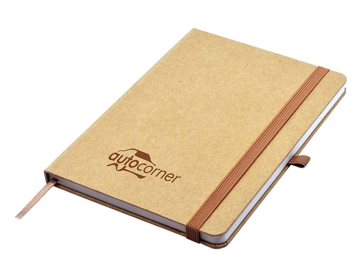 A brown notebook with a matching elastic band and ribbon bookmark. The cover features the logo autocorner with a car silhouette.