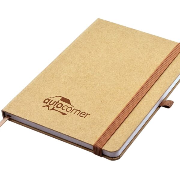 A brown journal with a logo on the cover. It has an elastic band closure, a pen loop, and a ribbon bookmark. The cover is simple and plain, with a smooth texture. The journal is closed and angled slightly to the side.
