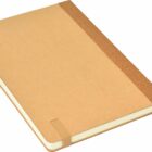 A closed, brown notebook lies on a white surface. It has a fabric spine and elastic bands to secure it, with a bookmark ribbon peeking out. The cover is plain and unadorned.