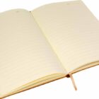 An open, lined notebook with a light brown cover. The pages are cream-colored, and theres a ribbon bookmark in the center. The notebook is lying flat on a white surface, showcasing its empty pages.