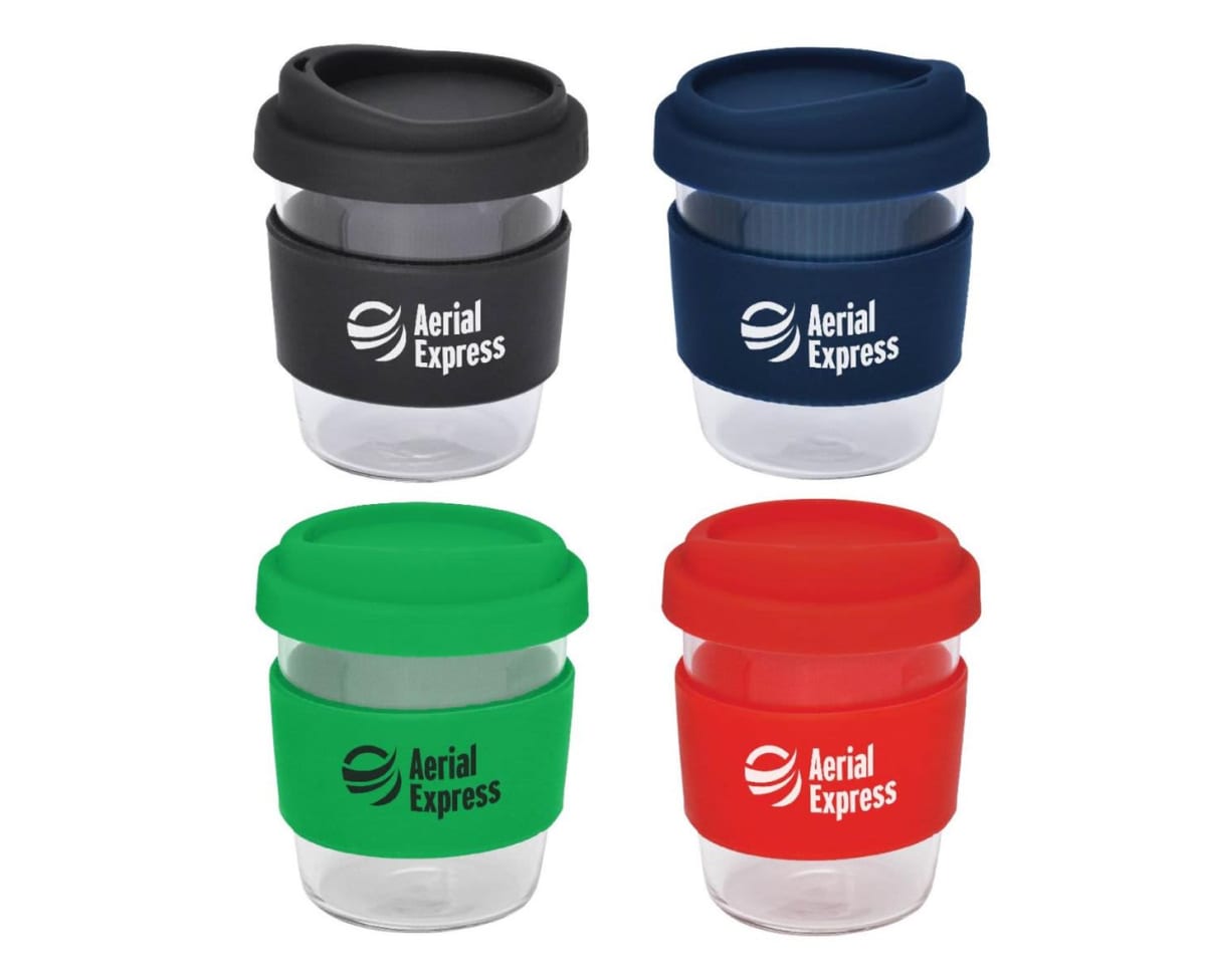 Four reusable coffee cups with silicone lids and bands in black, navy blue, green, and red. Each cup displays the Aerial Express logo. The cups are arranged in a 2x2 grid.