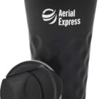 A black travel mug with a removable lid is filled with a frothy beverage. The mug features the Aerial Express logo in white print on its side.