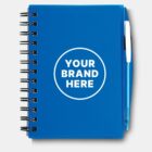 Blue spiral notebook with a white circle on the cover reading YOUR BRAND HERE. A blue pen is tucked into the notebooks spine.