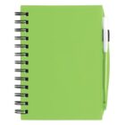 Green spiral notebook with a matching pen in its holder on the right side. The notebook cover is bright with a sleek finish, and the pen is white and green. The notebook is positioned upright, showing the front cover.