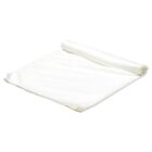 A white, folded cloth napkin with a smooth texture, partially unrolled on a flat surface.