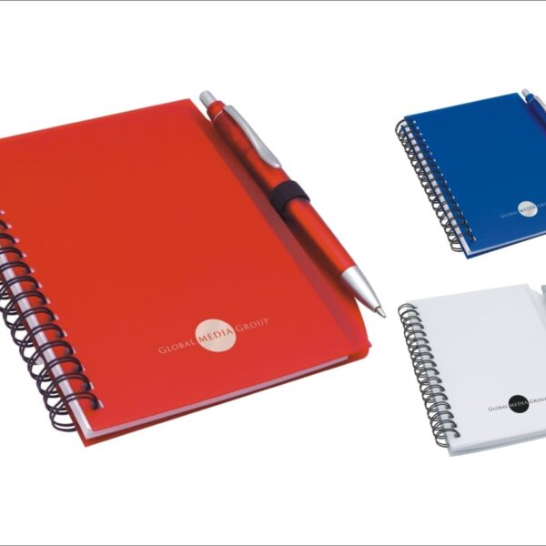 Image of three spiral-bound notebooks, each with a pen attached. The notebooks have red, blue, and white covers with Global Media Group printed on them. They are displayed on a white background.