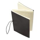 An open black notebook with cream-colored pages, some lined and some blank. A black elastic band is attached to the spine, used for securing the notebook closed.