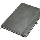 A closed gray notebook with a textured cover, an elastic band, and a ribbon bookmark is shown angled on a plain background.