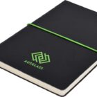 A black notebook with a green elastic band wrapped around it. The cover features a green geometric logo and the word AUSGLASS printed below. A black ribbon bookmark is visible at the bottom.