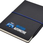 A black notebook featuring a blue car and Westside Automotive logo on the cover. It is bound with a blue elastic strap and has a pen secured inside.