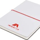 A closed white notebook with a red logo and the words Imprint Ltd on the cover. It features a red elastic band and a white ribbon bookmark. The notebook is shown at a slight angle.