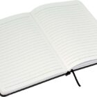 An open notebook with lined pages is displayed. It has a dark cover and a black ribbon bookmark placed in the center. The pages are blank, ready for writing or drawing.