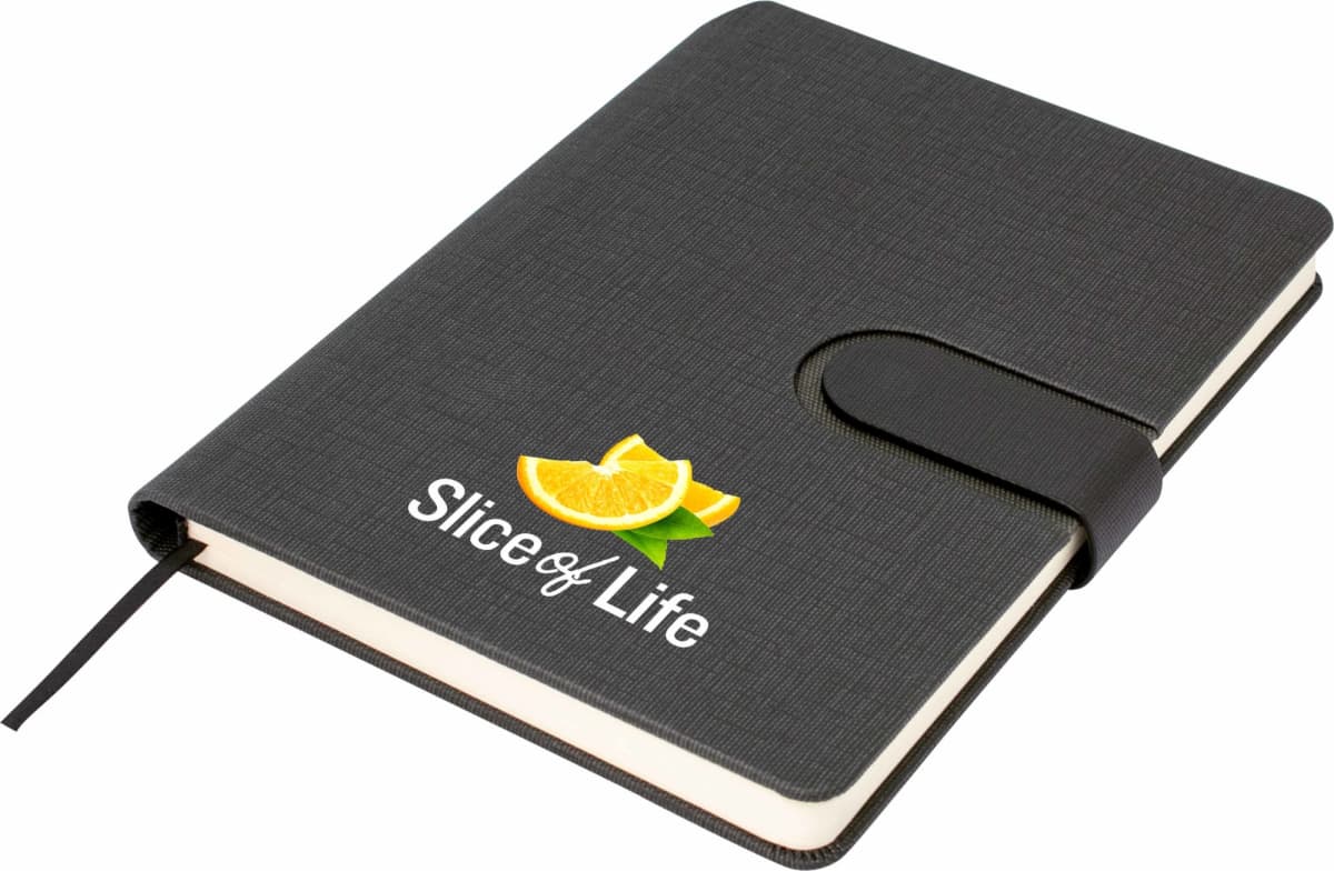 A black notebook with a strap closure, featuring the words Slice of Life and an image of a sliced orange on the cover.
