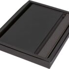 Black leather journal with a zippered pocket on the cover, placed inside a black box.
