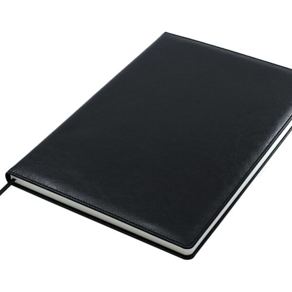 A closed black leather-bound notebook is shown. It has a sleek design and a ribbon page marker visible from the bottom. The cover appears smooth and slightly reflective under the light.