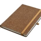 A brown speckled notebook with an elastic band closure and a ribbon bookmark.