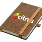A cork-covered notebook with the word cítrus and a colorful geometric logo on the cover. It has an elastic band for closure and a pen loop on the side.