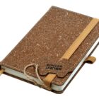 A brown textured notebook with a bonded leather cover and a tan elastic band closure. It features a pen loop and a bookmark ribbon.