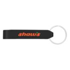 Black keychain with a silver ring, featuring the word shaws in orange lowercase letters on the body of the keychain.