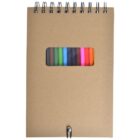 A brown spiral-bound notebook with a cutout window on the cover displaying various colored markers, including purple, green, orange, and blue. A pen is clipped at the bottom of the notebook.