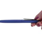 A hand holding a blue pen with black clip and cap, positioned horizontally. The persons nails are painted purple. The background is white.