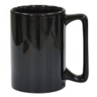 A glossy black ceramic mug with a large handle, shown against a white background. The mug is empty and has a smooth, shiny finish with reflections indicating its glossy surface.