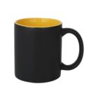 A black ceramic mug with a yellow interior, featuring a sturdy handle. The mug is empty and shown against a plain white background.