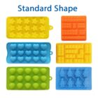 Six colorful silicone molds are displayed: yellow stars, orange bricks, blue hearts, green shells, yellow lego blocks, and blue robots. The text Standard Shape is above them.