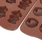 Brown silicone molds featuring shapes of cats and dogs for baking or crafting. The molds are designed to create small animal-shaped treats.