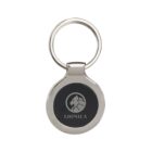 Silver keychain with a round, black center featuring a stylized lion logo and the text LIONICA beneath it.
