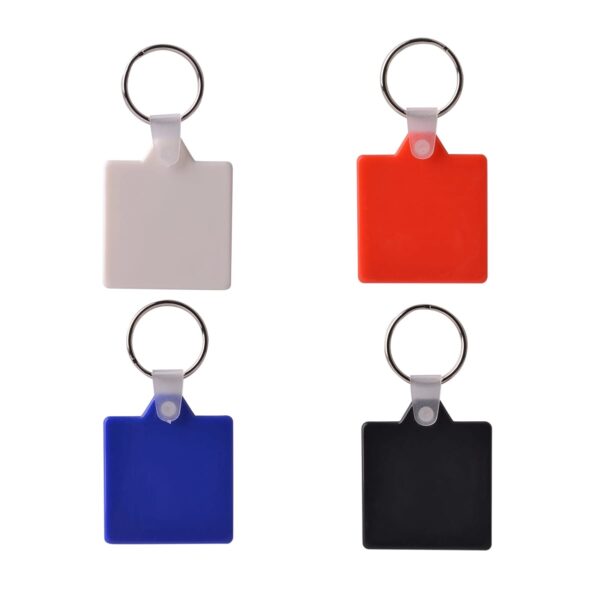 Four square keychains with metal rings, arranged in a 2x2 grid. From top left to bottom right: white, red, blue, and black. Each keychain has a small connecting loop at the top. White background.