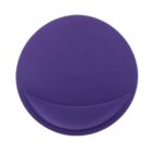 A round, dark purple object resembling a makeup sponge from a top view, featuring a smooth surface and a curved indentation near the bottom edge.